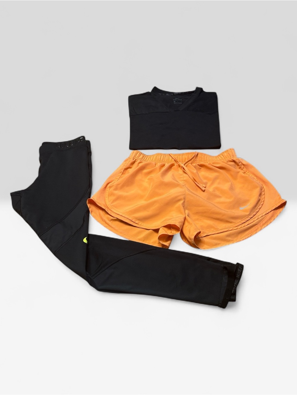 Nike Orange Women’s Athletic Shorts with Black Leggings and Top